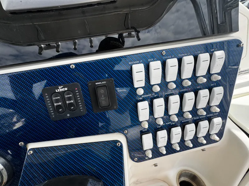 Slide: The Image of Control panel of a 2008 Hydra-Sports Vector 3300 VX boat with switches and controls. - 19