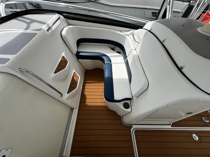 Slide: The Image of 2008 Hydra-Sports Vector 3300 VX boat interior with white and navy seating, teak flooring. - 26