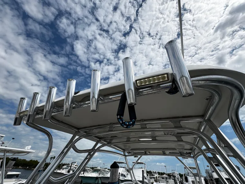 Slide: The Image of 2008 Hydra-Sports Vector 3300 VX boat with rod holders under a cloudy sky. - 28