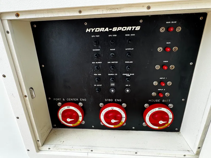 Slide: The Image of Control panel of a 2008 Hydra-Sports Vector 3300 VX boat, featuring engine and battery switches. - 32
