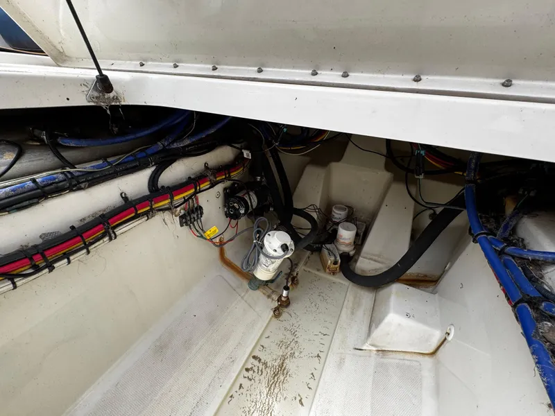 Slide: The Image of 2008 Hydra-Sports Vector 3300 VX engine compartment with wiring and components visible. - 33