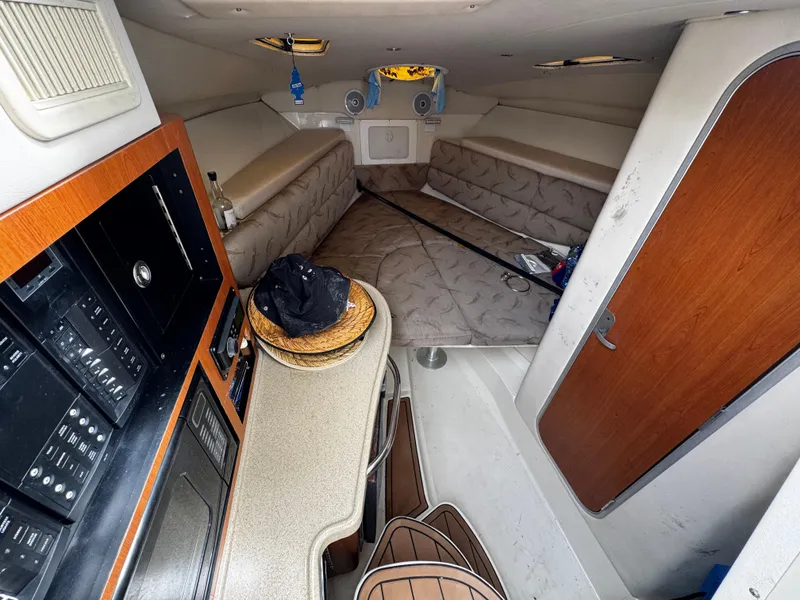 Slide: The Image of 2008 Hydra-Sports Vector 3300 VX cabin interior with seating, table, and fishing rod. - 35