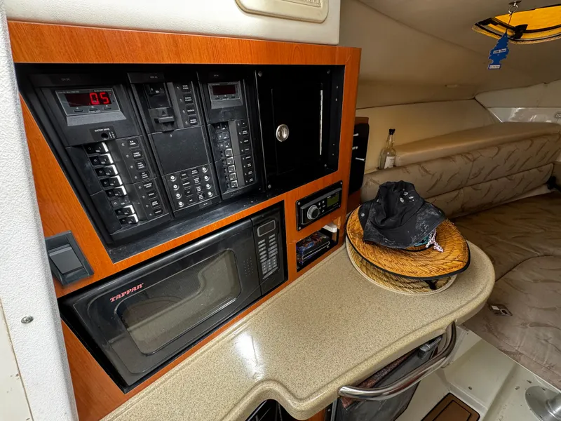 Slide: The Image of 2008 Hydra-Sports Vector 3300 VX cabin interior with control panel and microwave. - 38