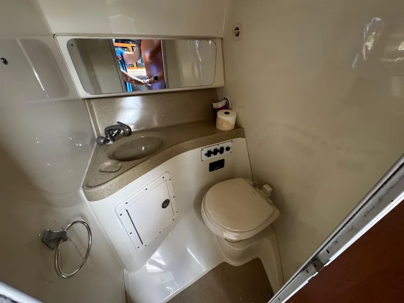 Slide: The Image of 2008 Hydra-Sports Vector 3300 VX boat bathroom with sink, toilet, and mirror. - 39