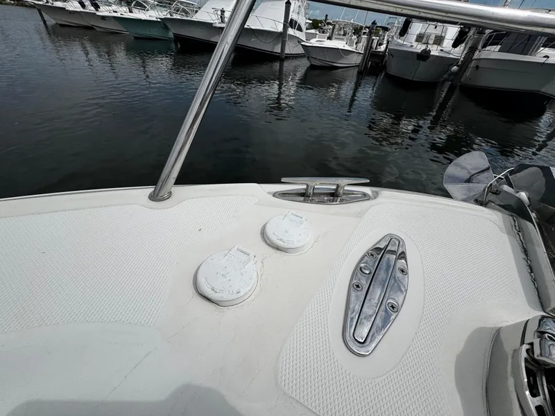 Slide: The Image of 2008 Hydra-Sports Vector 3300 VX boat deck at marina, showing cleats and fittings. - 43