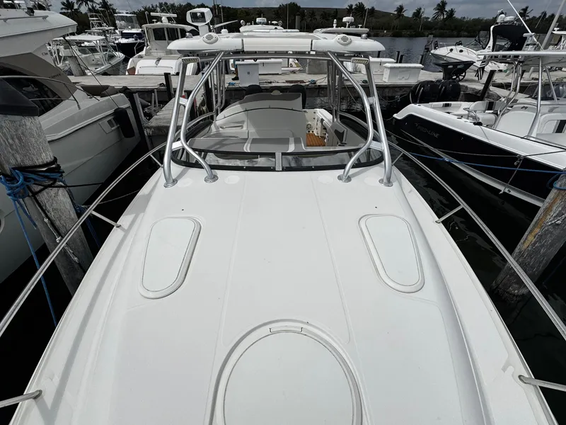 Slide: The Image of 2008 Hydra-Sports Vector 3300 VX boat docked among other vessels. - 44