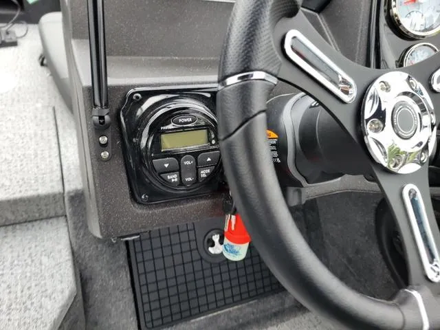 Slide: The Image of 2024 Tracker Targa™ V-19 Combo dashboard with steering wheel and control panel. - 10