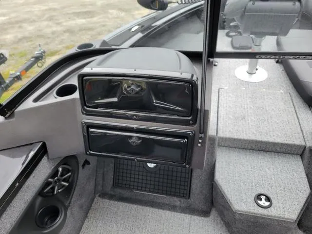 Slide: The Image of 2024 Tracker Targa™ V-19 Combo boat interior with storage compartments and speaker. - 12