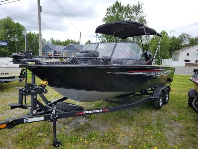 Slide: The Image of 2024 Tracker Targa™ V-19 Combo boat on trailer, parked outdoors. - 4