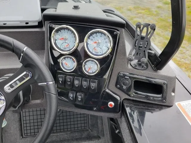 Slide: The Image of 2024 Tracker Targa™ V-19 Combo dashboard with gauges and controls. - 9