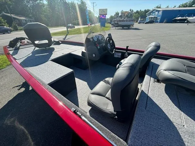 Slide: The Image of 2024 Tracker Pro 170 boat interior with seating and steering console. - 10