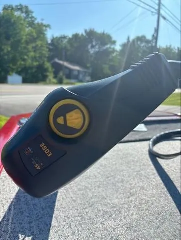 Slide: The Image of Close-up of a 2024 Tracker Pro 170 boat throttle control in sunlight. - 7