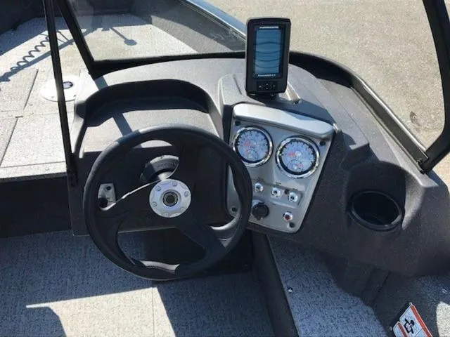 Slide: The Image of 2024 Tracker Pro Guide V-16 WT dashboard with steering wheel and gauges. - 4