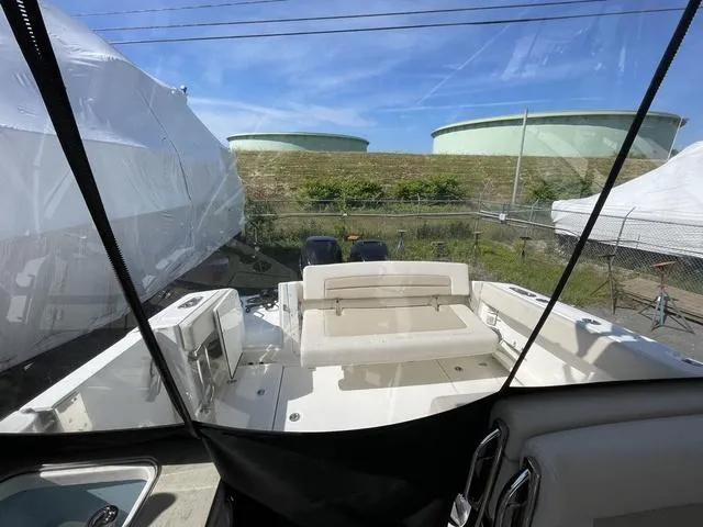 Slide: The Image of 2016 Boston Whaler 320 Vantage boat interior with seating, viewed from cockpit. - 15