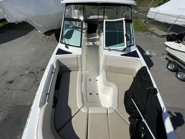 Slide: The Image of 2016 Boston Whaler 320 Vantage boat interior with seating and windshield. - 17