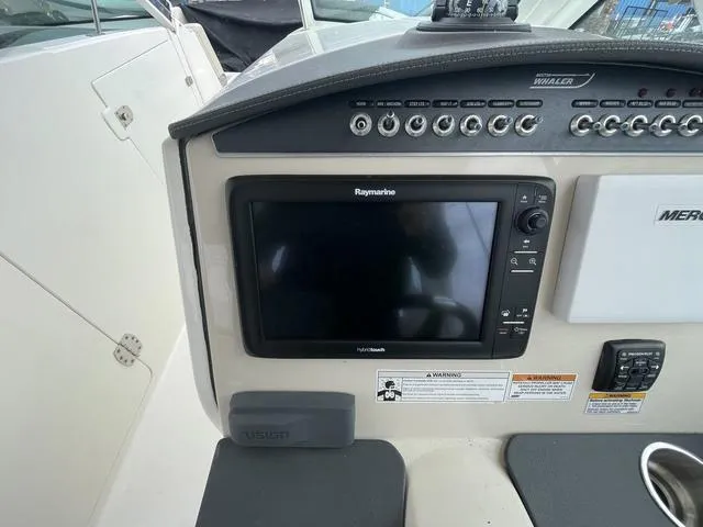 Slide: The Image of Control panel of 2016 Boston Whaler 320 Vantage with Raymarine display. - 23