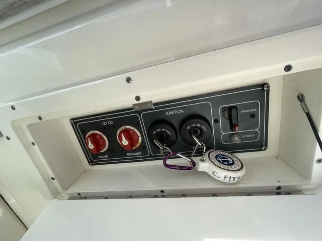 Slide: The Image of Control panel of a 2016 Boston Whaler 320 Vantage boat with ignition keys. - 26