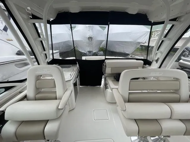 Slide: The Image of 2016 Boston Whaler 320 Vantage interior with plush seating and modern design. - 9