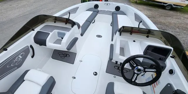 Slide: The Image of 2024 Tahoe T21 boat interior with modern seating and steering wheel design. - 3