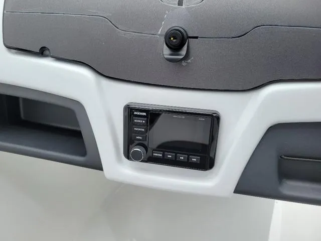 Slide: The Image of Dashboard of 2024 Tahoe 210 S boat with audio system and camera. - 13