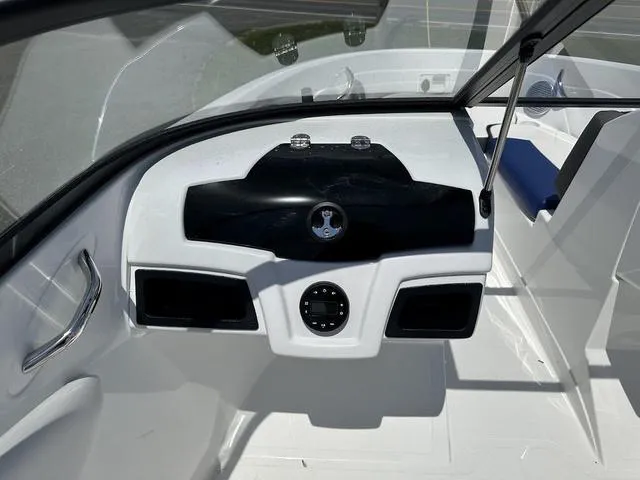 Slide: The Image of 2024 Tahoe 200 S boat dashboard with sleek black and white design. - 7