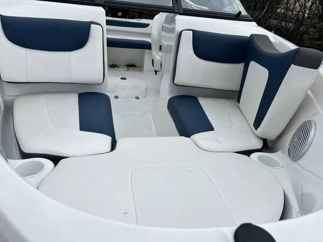 Slide: The Image of Interior seating of 2021 Tahoe 450 TS boat with white and blue upholstery. - 9
