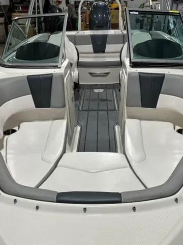 Slide: The Image of 2021 Chaparral 19 SSi boat interior with white and gray seating. - 6
