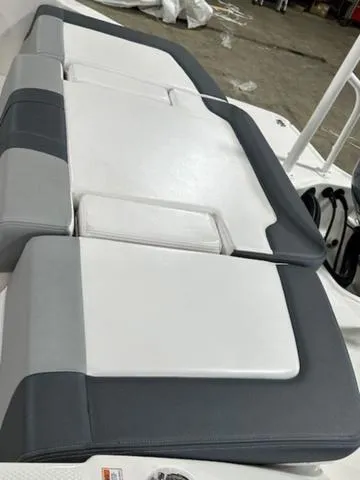 Slide: The Image of 2021 Chaparral 19 SSi boat seating, featuring gray and white cushioned design. - 7