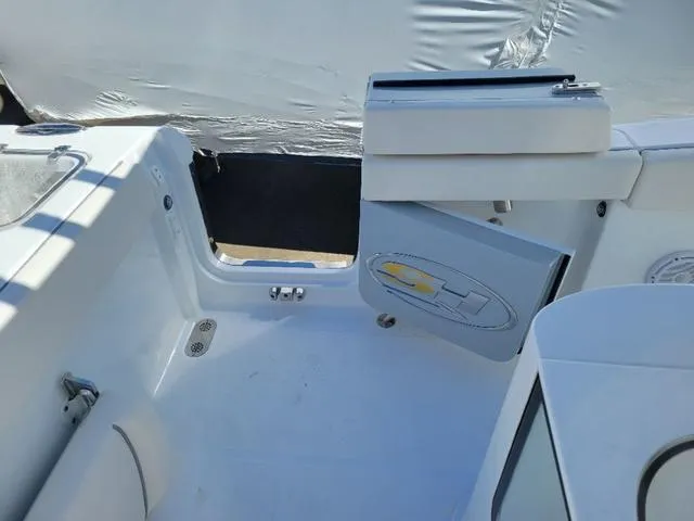 Slide: The Image of 2024 Sea Hunt Gamefish 25 boat interior, featuring open storage compartment and seating area. - 12