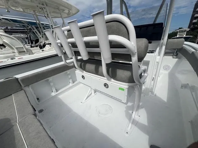 Slide: The Image of 2025 Sea Hunt Ultra 219 boat interior with seating and rod holders. - 16