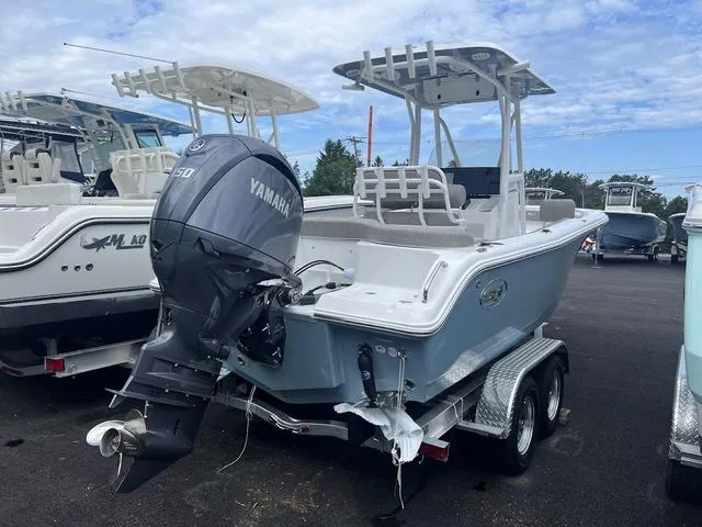 Slide: The Image of 2025 Sea Hunt Ultra 219 boat with Yamaha engine on a trailer. - 3
