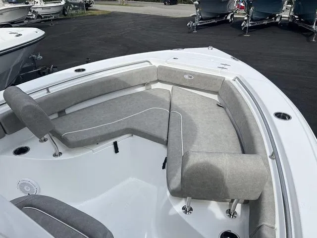 Slide: The Image of 2025 Sea Hunt Ultra 219 boat with spacious gray seating area. - 5