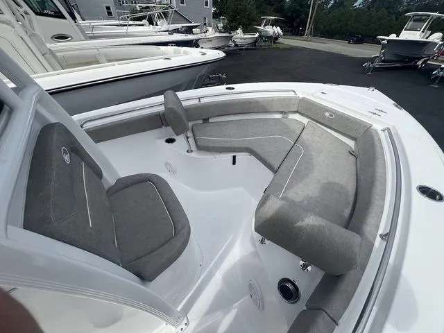 Slide: The Image of 2025 Sea Hunt Ultra 219 boat interior with gray seating and spacious layout. - 6