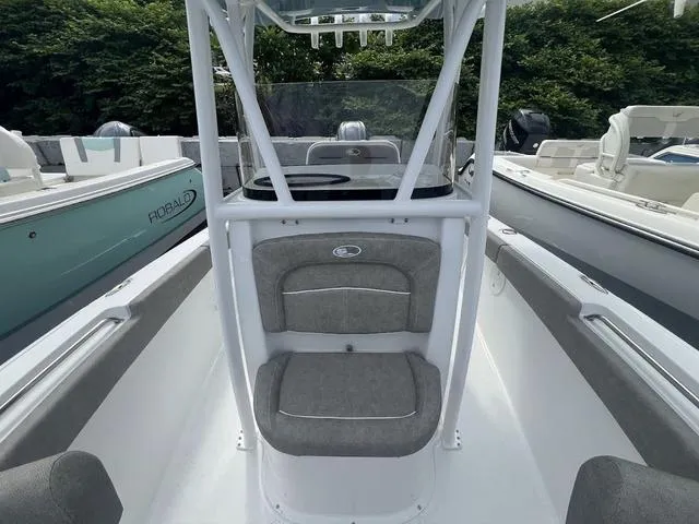 Slide: The Image of 2025 Sea Hunt Ultra 219 boat interior with seating and console. - 7