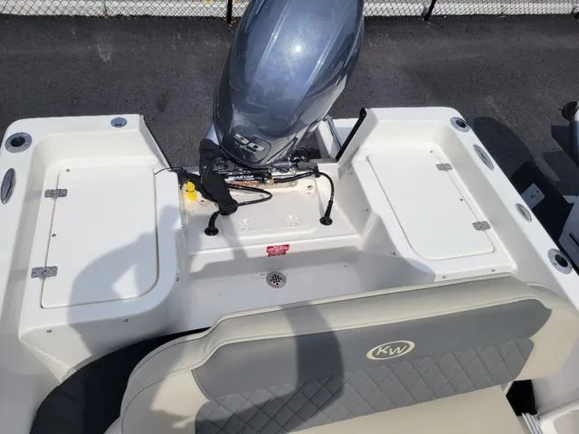 Slide: The Image of 2025 Key West 1720 CC boat with outboard motor, rear seating, and storage compartments. - 11