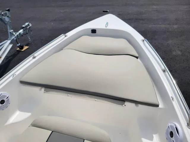 Slide: The Image of 2025 Key West 1720 CC boat interior with cushioned seating and speakers. - 12