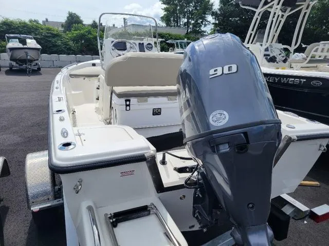 Slide: The Image of 2025 Key West 1720 CC boat with 90 HP engine, displayed outdoors. - 4