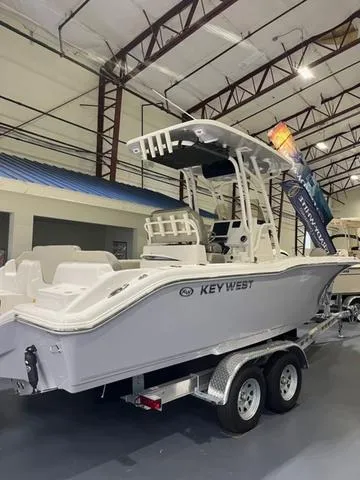 Slide: The Image of 2025 Key West 239 FS boat on trailer in showroom. - 1