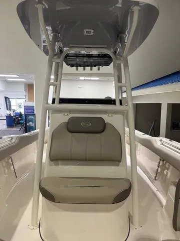 Slide: The Image of 2025 Key West 239 FS boat interior with cushioned seating and modern design. - 9