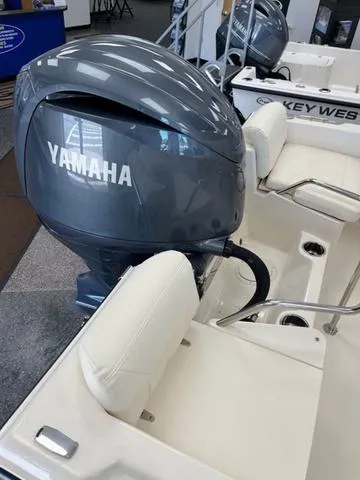 Slide: The Image of 2025 Grady-White Fisherman 180 with Yamaha outboard motor, featuring sleek design and comfortable seating. - 12