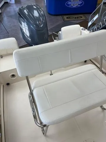 Slide: The Image of 2025 Grady-White Fisherman 180 boat interior with white seating and motor. - 9
