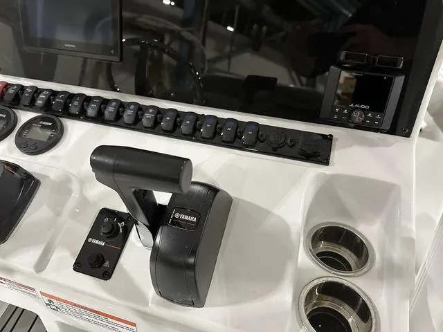Slide: The Image of Control panel of 2025 Sea Hunt Ultra 229 boat with Yamaha throttle and gauges. - 10