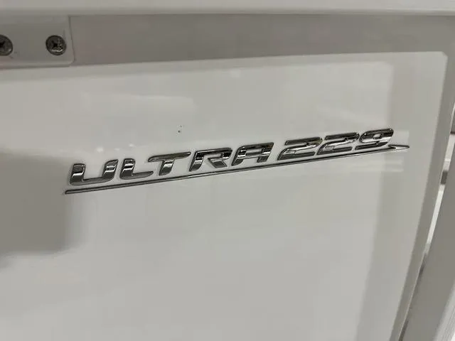 Slide: The Image of 2025 Sea Hunt Ultra 229 boat emblem on white surface. - 12