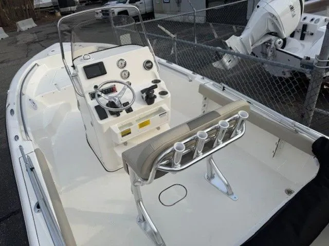 Slide: The Image of 2025 Key West 189 FS boat interior with steering console and rod holders. - 4
