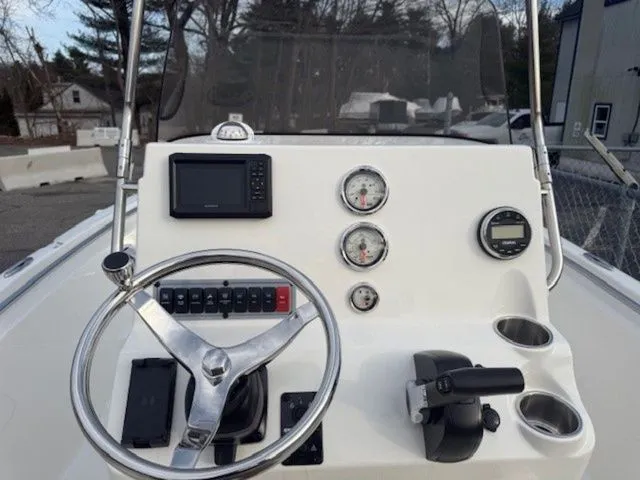 Slide: The Image of 2025 Key West 189 FS boat dashboard with steering wheel and gauges. - 6