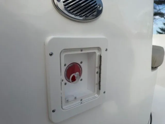 Slide: The Image of 2025 Key West 189 FS boat detail showing a control panel with a red switch. - 9