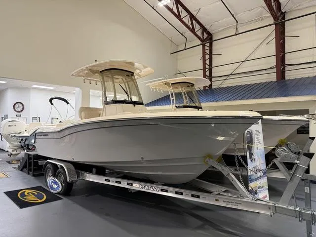 Slide: The Image of 2025 Grady-White Fisherman 216 boat on trailer in showroom. - 1