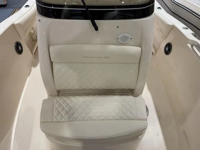 Slide: The Image of 2025 Grady-White Fisherman 216 boat interior with cushioned seating and modern design. - 8