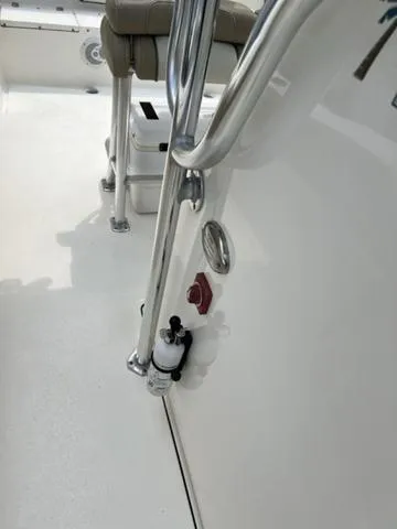 Slide: The Image of 2019 Key West 239FS boat interior with seating and railing details. - 10