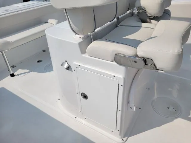 Slide: The Image of 2024 Sea Hunt Gamefish 27 boat interior with forward seating and storage compartment. - 15